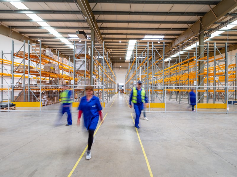 Blurred photo of workers walking into factory